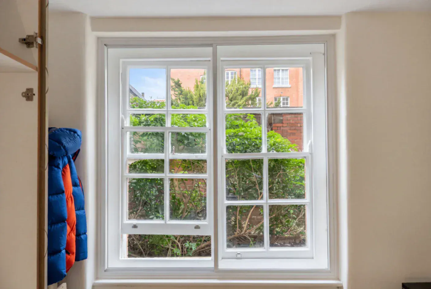 Secondary glazing in a multi-pane period window