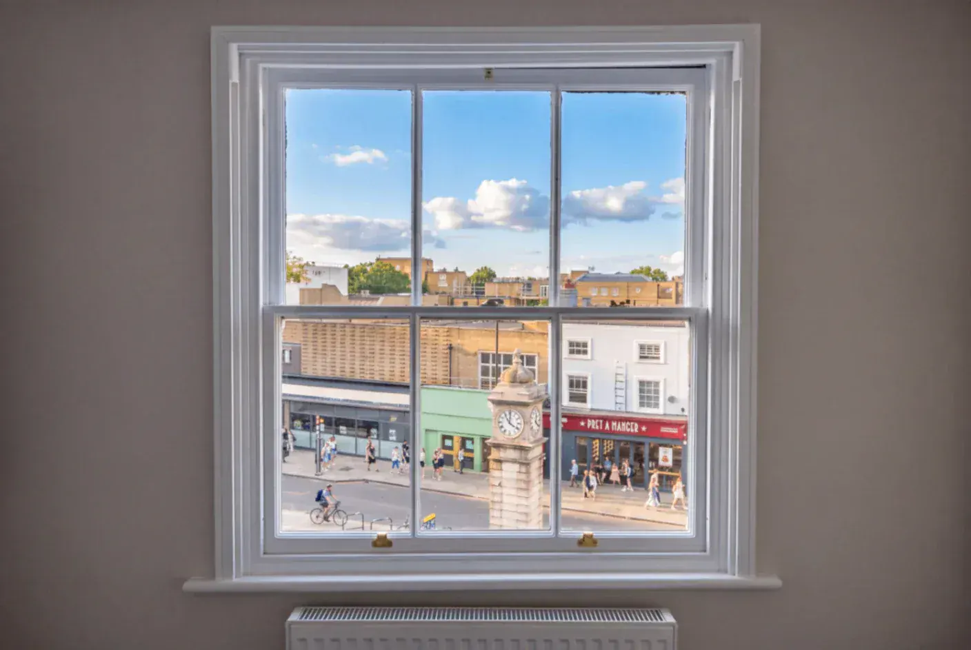 Secondary glazing in a sash window overlooking a town street