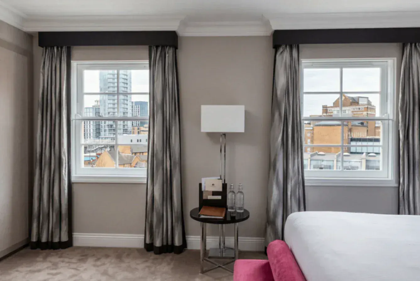 Secondary glazing in a room with two sash windows
