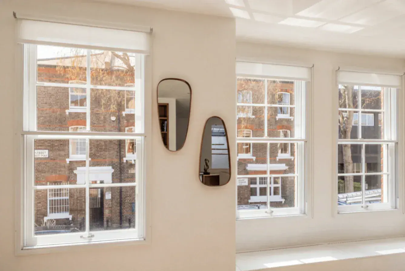 Secondary glazing in a period room with three sash windows