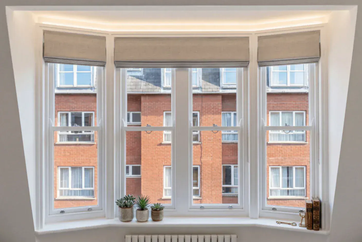 Secondary glazing across a bay window