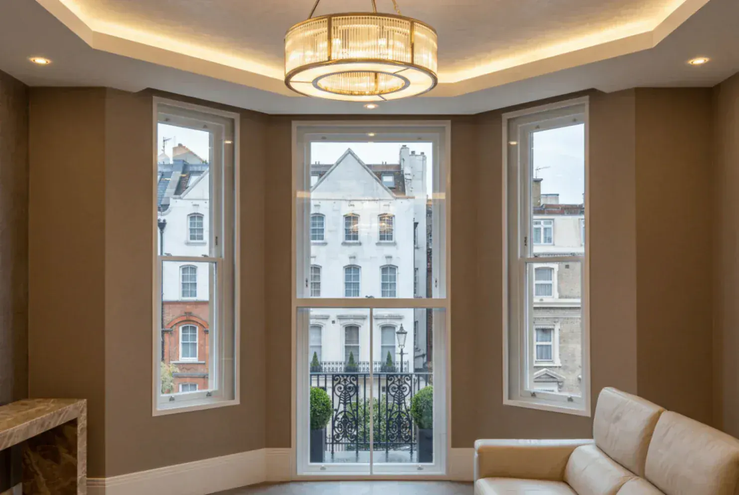 Secondary glazing around a bay window and glazed door