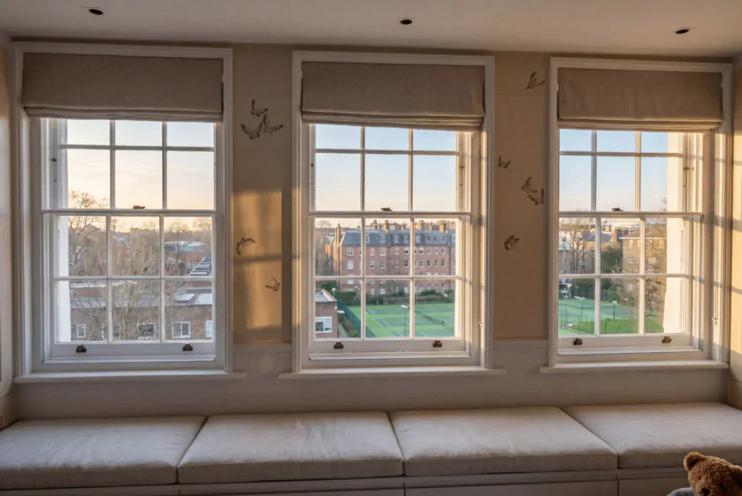 Secondary glazing across three sash windows
