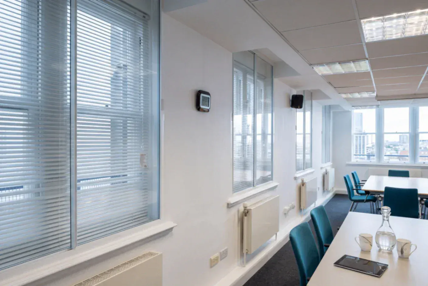 Secondary glazing in a commercial meeting room