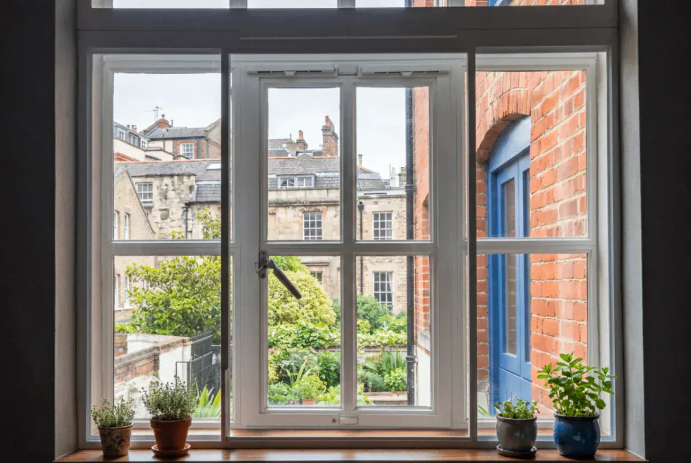Secondary glazing in a period window overlooking a garden