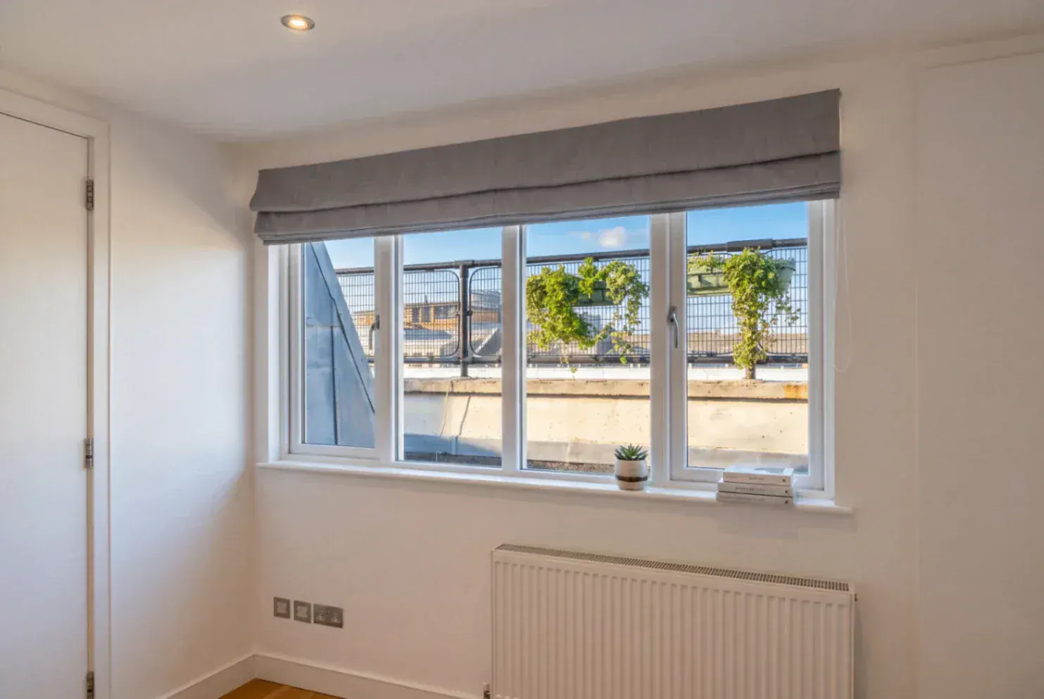 Secondary glazing in a bright room with a wide window