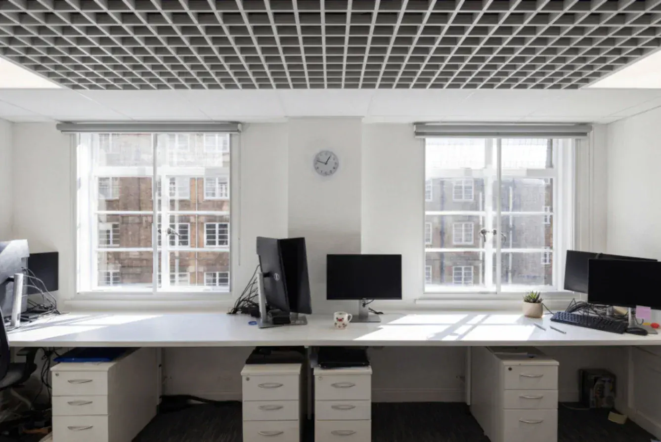 Secondary glazing in an office with workstations